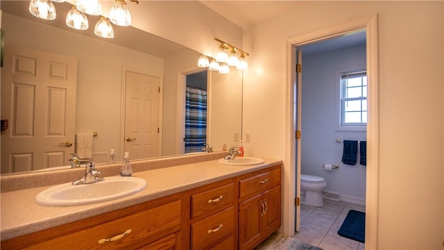 107 Skyview Dr, Buffalo Twp But, PA 16055 - bathroom with toilet, double vanity, tile patterned floors, and a sink
