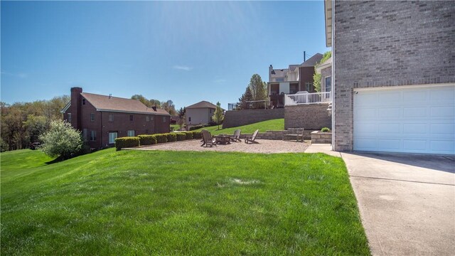 107 Skyview Dr, Buffalo Twp But, PA 16055 - view of yard with a garage, a fire pit, driveway, and a residential view