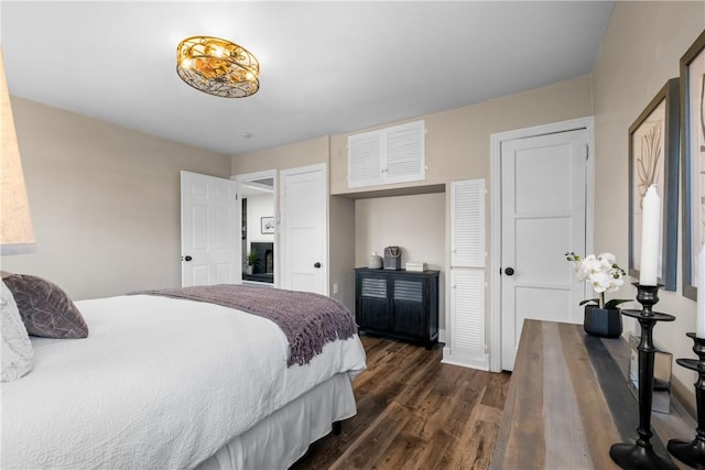 bedroom featuring dark wood-style flooring