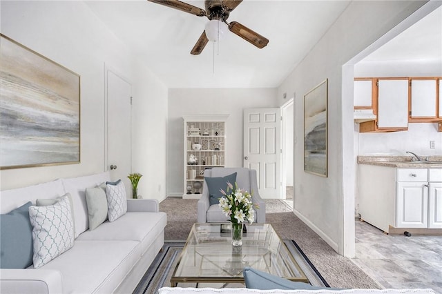 616 Evans Ave, Mckeesport, PA 15132 - living area featuring a ceiling fan and baseboards