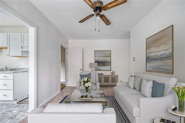 616 Evans Ave, Mckeesport, PA 15132 - living room featuring a ceiling fan and baseboards