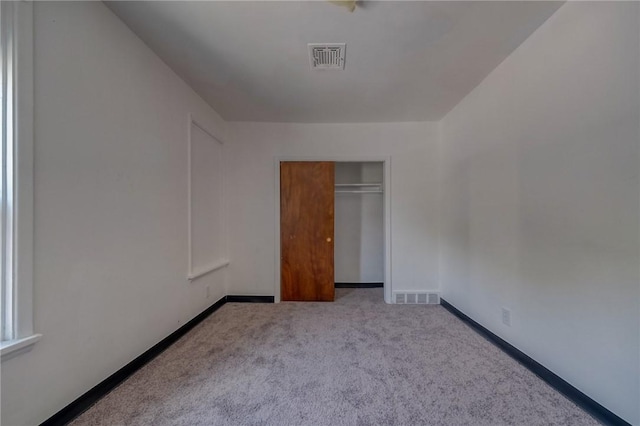 616 Evans Ave, Mckeesport, PA 15132 - unfurnished bedroom with carpet, a closet, and baseboards