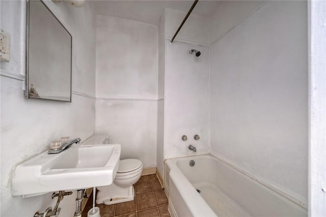 616 Evans Ave, Mckeesport, PA 15132 - full bathroom with toilet, tile patterned flooring, washtub / shower combination, and a sink