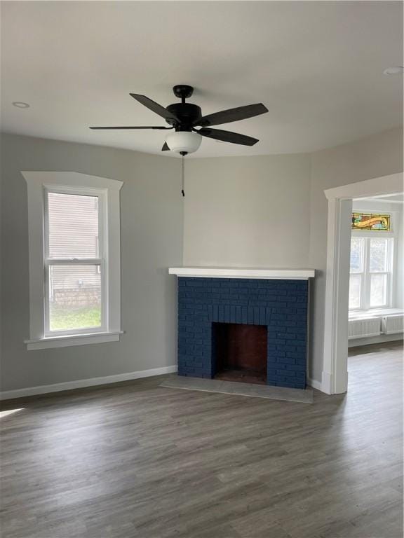 280 Spruce, Sharon, PA 16146 - unfurnished living room with a ceiling fan, baseboards, plenty of natural light, and wood finished floors
