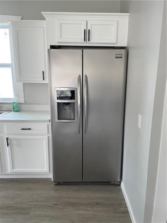 280 Spruce, Sharon, PA 16146 - kitchen featuring light countertops, stainless steel fridge with ice dispenser, light wood finished floors, and white cabinetry