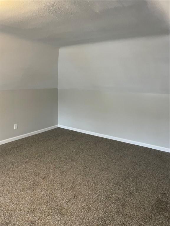 280 Spruce, Sharon, PA 16146 - bonus room with baseboards, vaulted ceiling, and dark colored carpet