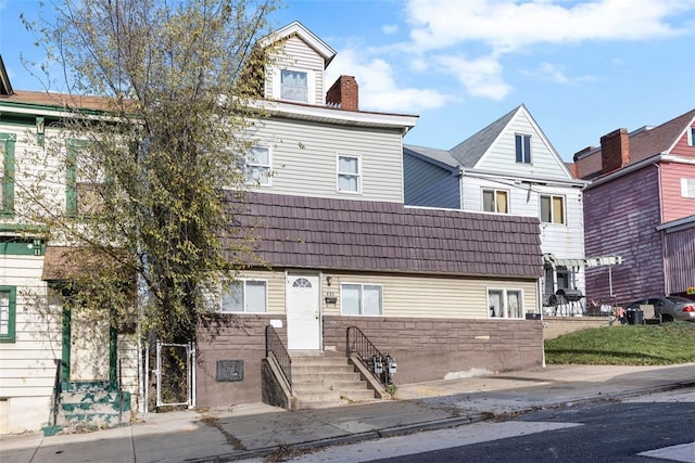 multi unit property featuring a chimney