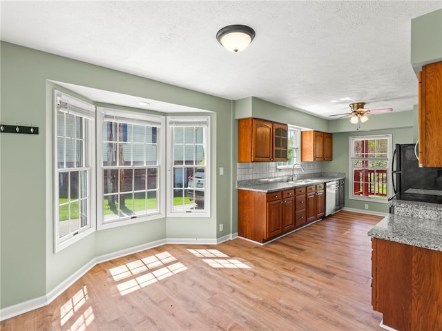 297 Rainey Rd, Somerset Twp, PA 15330 - kitchen with baseboards, freestanding refrigerator, a textured ceiling, and dishwasher