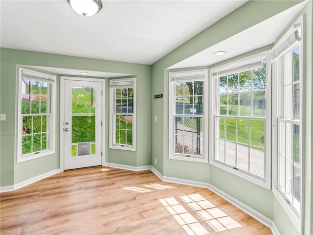 297 Rainey Rd, Somerset Twp, PA 15330 - doorway with baseboards and light wood-type flooring