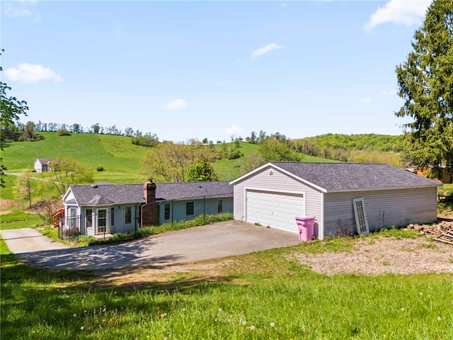 297 Rainey Rd, Somerset Twp, PA 15330 - ranch-style house featuring a chimney and a detached garage