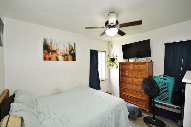 carpeted bedroom featuring a ceiling fan