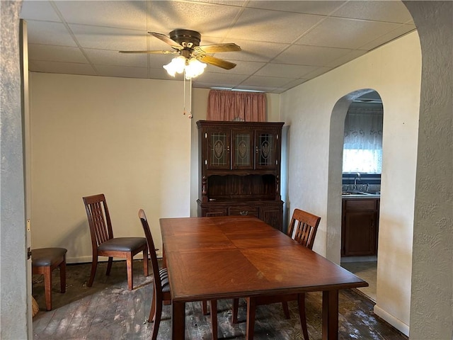 460 E Prospect Ave, City Of Washington, PA 15301 - dining room featuring arched walkways, a paneled ceiling, a ceiling fan, baseboards, and hardwood / wood-style flooring