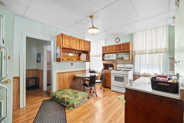 101 Clara St, Millvale, PA 15209 - kitchen featuring white appliances, open shelves, and a paneled ceiling