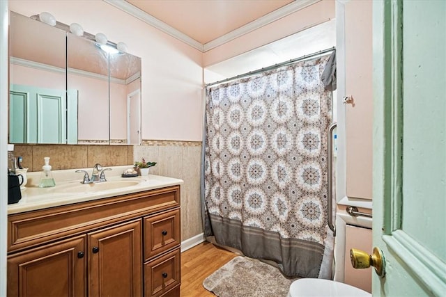 101 Clara St, Millvale, PA 15209 - bathroom featuring wood finished floors, curtained shower, vanity, a wainscoted wall, and ornamental molding