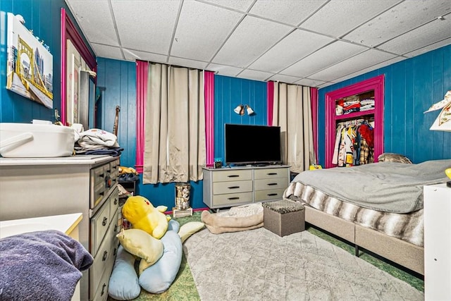 101 Clara St, Millvale, PA 15209 - carpeted bedroom with a drop ceiling and wooden walls