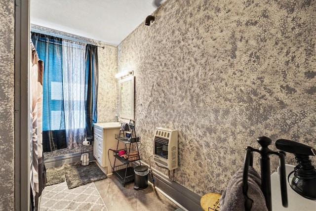 101 Clara St, Millvale, PA 15209 - bathroom featuring heating unit, vanity, and wallpapered walls