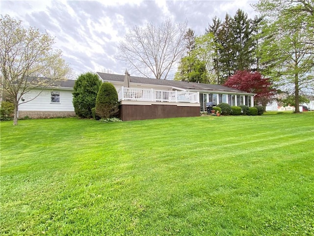 view of yard featuring a deck