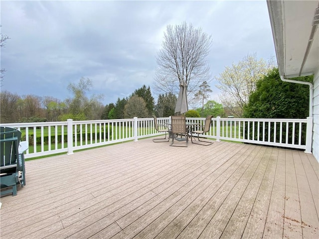 wooden terrace with outdoor dining space