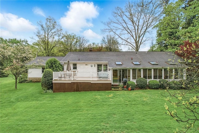 16 Gruber Rd, Hempfield Twp Mer, PA 16125 - back of property with a lawn, a wooden deck, a sunroom, and a shingled roof