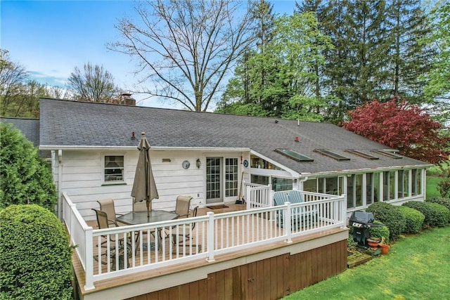 16 Gruber Rd, Hempfield Twp Mer, PA 16125 - back of property featuring a chimney, a sunroom, a shingled roof, and a wooden deck