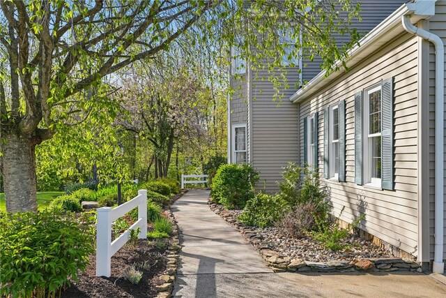 view of home's community with fence