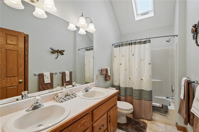 full bathroom with a sink, toilet, lofted ceiling with skylight, and shower / tub combo