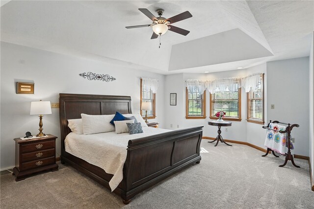 bedroom with baseboards, light carpet, and a ceiling fan