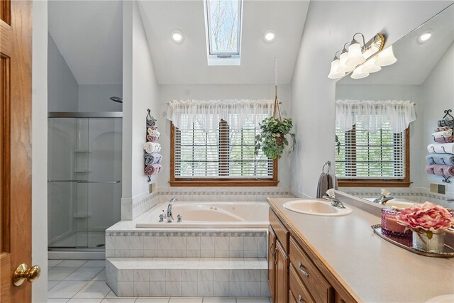 full bath with a bath, tile patterned flooring, a shower stall, vanity, and lofted ceiling with skylight