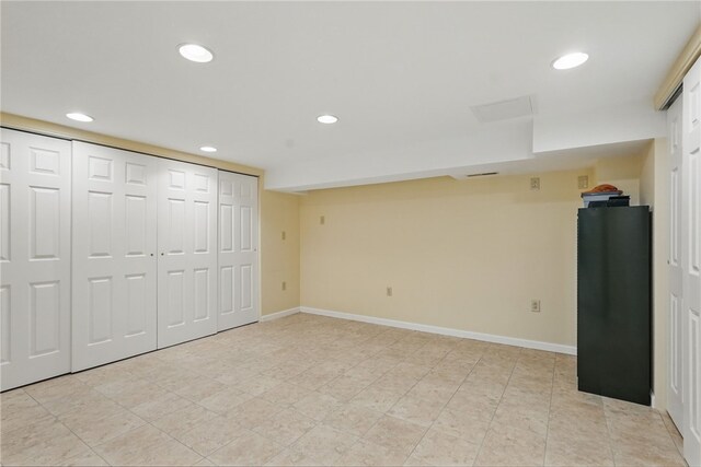 finished basement featuring recessed lighting and baseboards