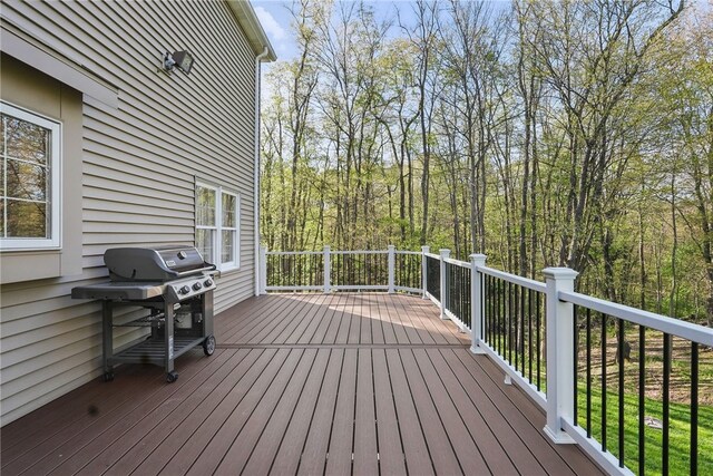 wooden terrace with area for grilling