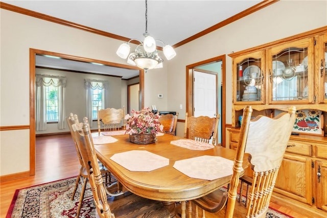 204 Salt Works Rd, Lancaster Twp, PA 16037 - dining space featuring ornamental molding, light wood-style flooring, and a chandelier