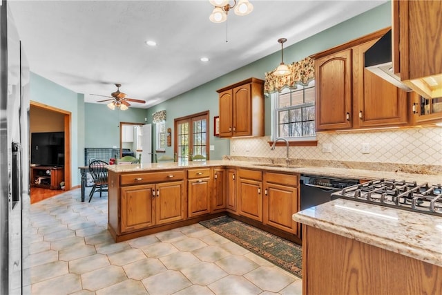 204 Salt Works Rd, Lancaster Twp, PA 16037 - kitchen with ceiling fan, a peninsula, brown cabinetry, and recessed lighting
