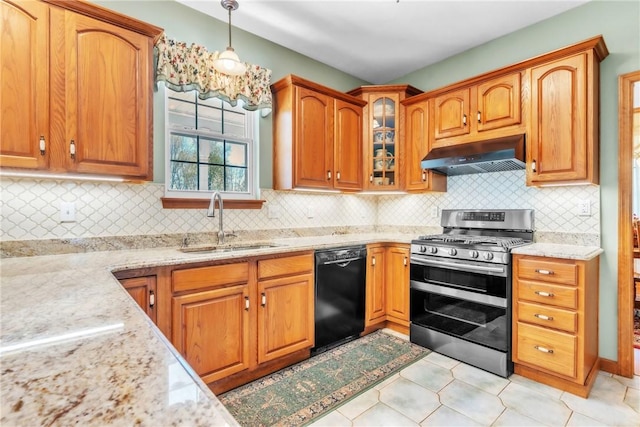 204 Salt Works Rd, Lancaster Twp, PA 16037 - kitchen featuring dishwasher, under cabinet range hood, range with two ovens, light stone counters, and pendant lighting