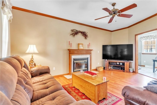 204 Salt Works Rd, Lancaster Twp, PA 16037 - living area featuring wood finished floors, crown molding, a glass covered fireplace, and ceiling fan