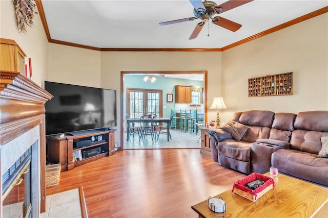 204 Salt Works Rd, Lancaster Twp, PA 16037 - living area featuring light wood-type flooring, ceiling fan, a tile fireplace, and crown molding