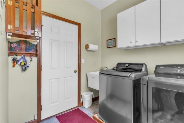 204 Salt Works Rd, Lancaster Twp, PA 16037 - laundry area featuring washing machine and dryer and cabinet space