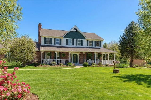 204 Salt Works Rd, Lancaster Twp, PA 16037 - view of front of home featuring covered porch, a chimney, a front yard, and brick siding