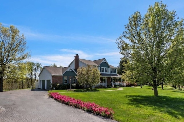 204 Salt Works Rd, Lancaster Twp, PA 16037 - view of front of house featuring driveway, a front yard, a chimney, and a garage