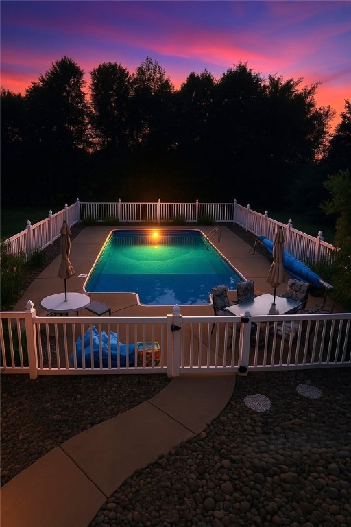 204 Salt Works Rd, Lancaster Twp, PA 16037 - pool at dusk with a patio area