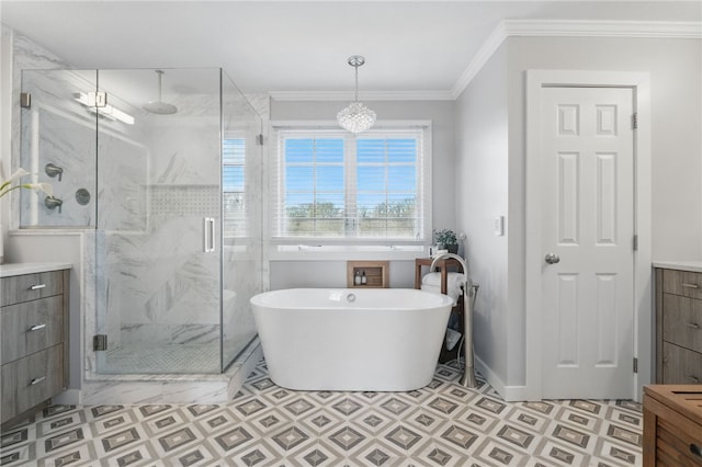 bathroom with a freestanding bath, a marble finish shower, crown molding, and vanity