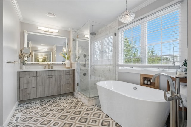 full bath with crown molding, vanity, a freestanding tub, baseboards, and a shower stall