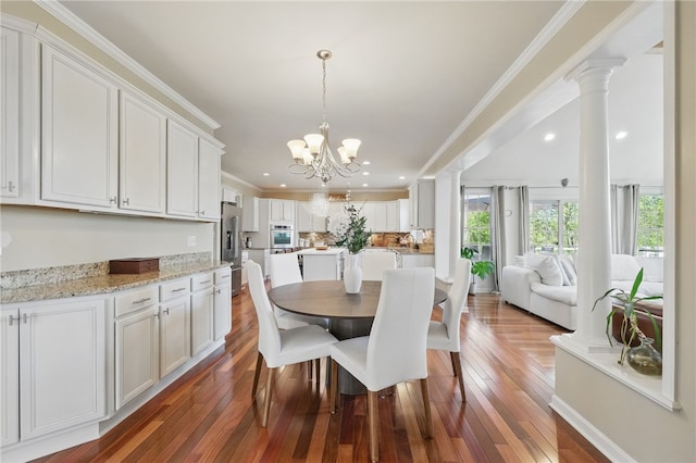 dining area with recessed lighting, crown molding, a chandelier, and hardwood / wood-style floors