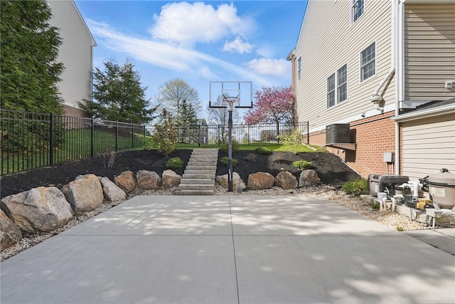 view of patio / terrace featuring fence and stairs