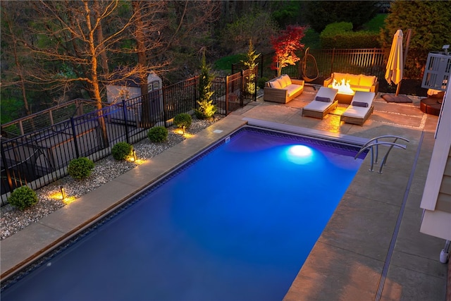 view of swimming pool with a fenced in pool, an outdoor fire pit, a patio area, and fence