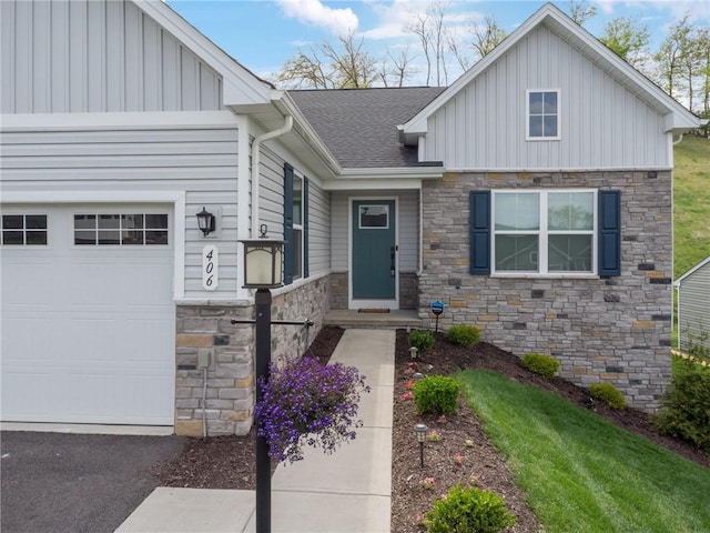 406 Spruce Ln, Chartiers, PA 15342 - view of front of house with a garage, board and batten siding, roof with shingles, and stone siding