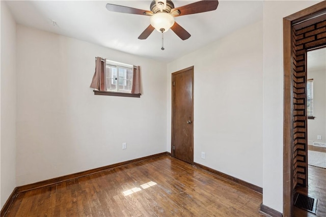 413 Pasadena Dr, Port Vue, PA 15133 - spare room with baseboards, a ceiling fan, and wood finished floors