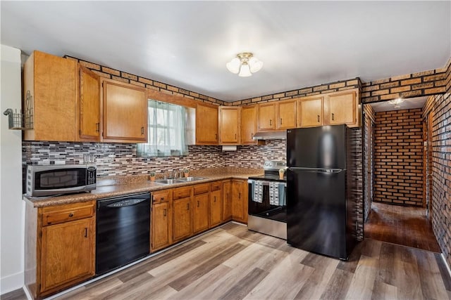 413 Pasadena Dr, Port Vue, PA 15133 - kitchen featuring light wood-style floors, a sink, backsplash, and black appliances
