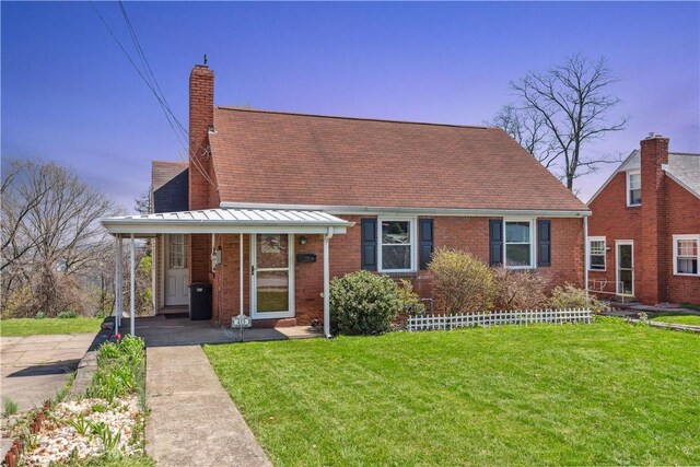 413 Pasadena Dr, Port Vue, PA 15133 - new england style home with a porch, brick siding, a chimney, and a front yard