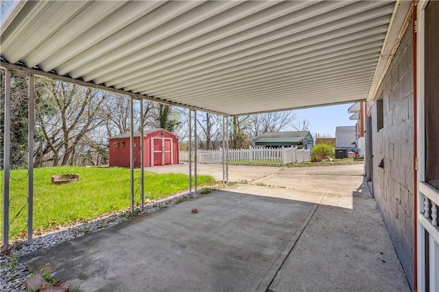 413 Pasadena Dr, Port Vue, PA 15133 - view of patio / terrace featuring fence, a storage unit, and an outbuilding