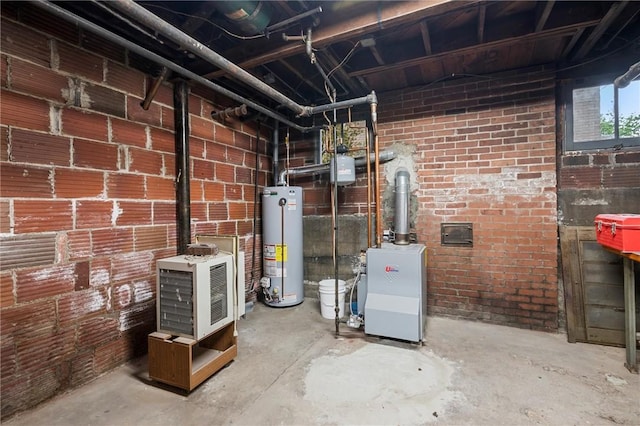 utility room with a heating unit and gas water heater